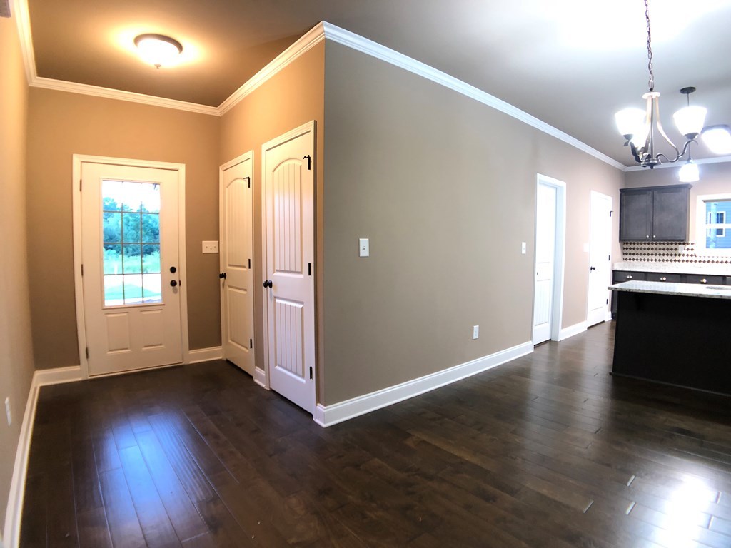 330 Walnut Grove Road Gray, GA 31032 - Photo 5 of 42 an empty room with wooden floor and windows