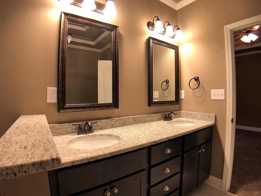 330 Walnut Grove Road Gray, GA 31032 - Photo 41 of 42 a bathroom with a double vanity sink and a mirror