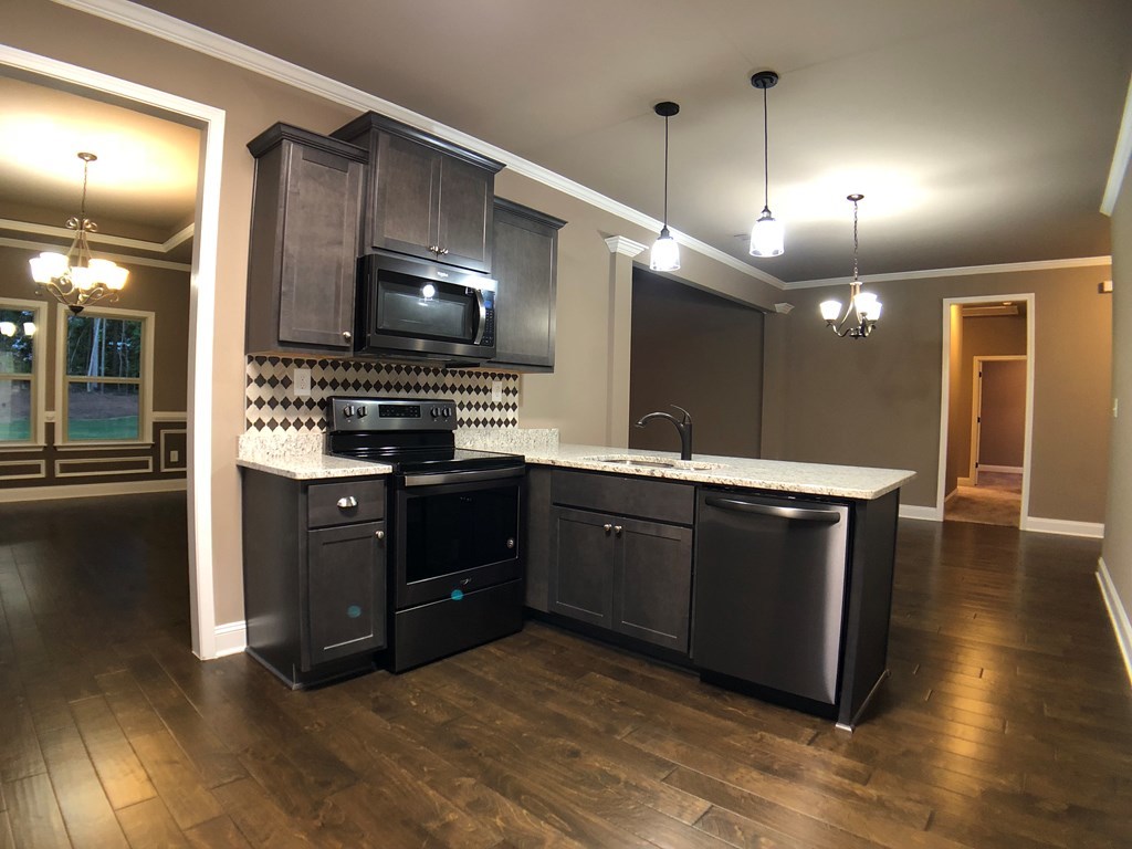 330 Walnut Grove Road Gray, GA 31032 - Photo 10 of 42 a kitchen with a sink and a stove top oven