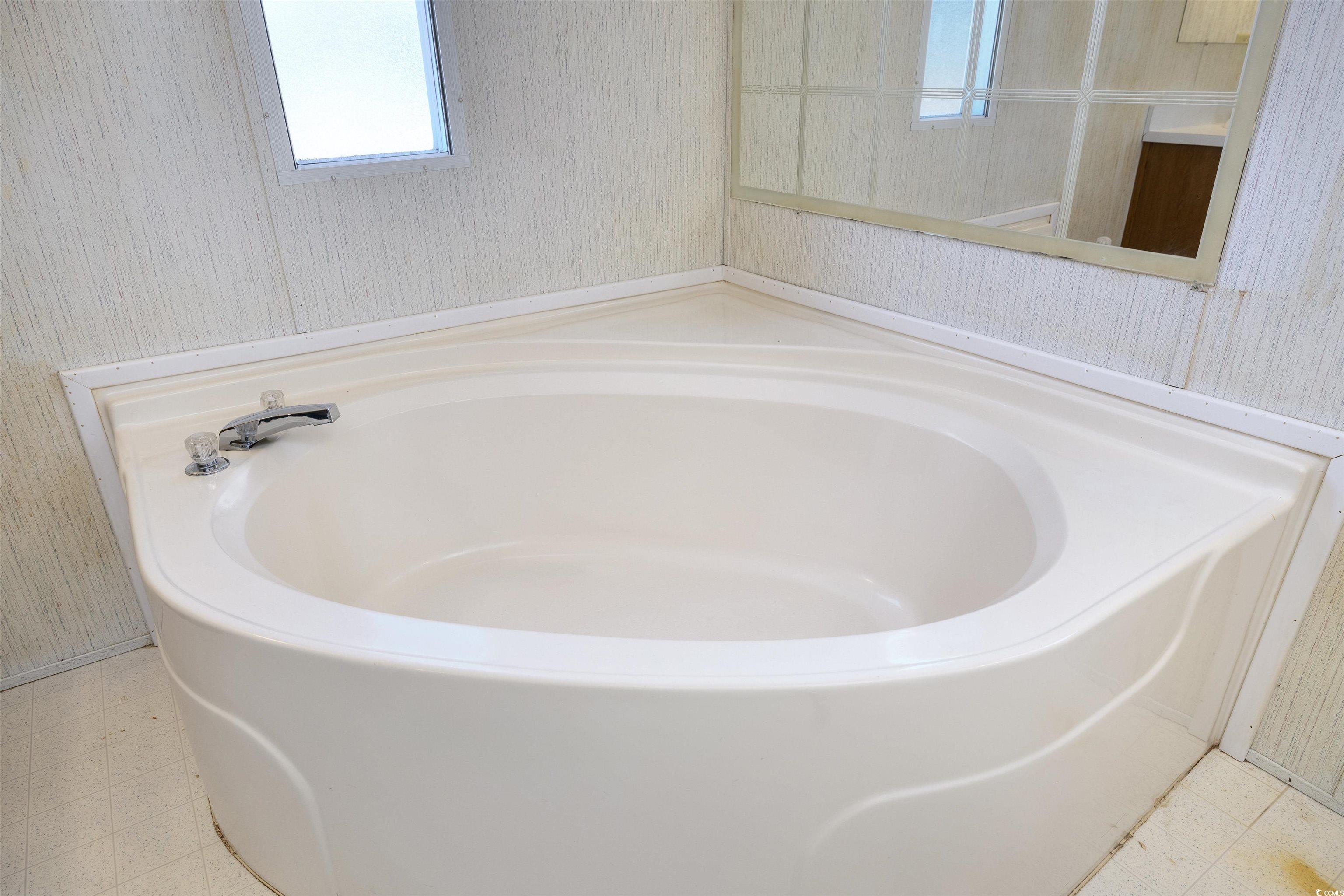 4535 Old Tram Road Conway, SC 29527 - Photo 19 of 36 Full bathroom with wallpapered walls, tile patterned floors, and a bath