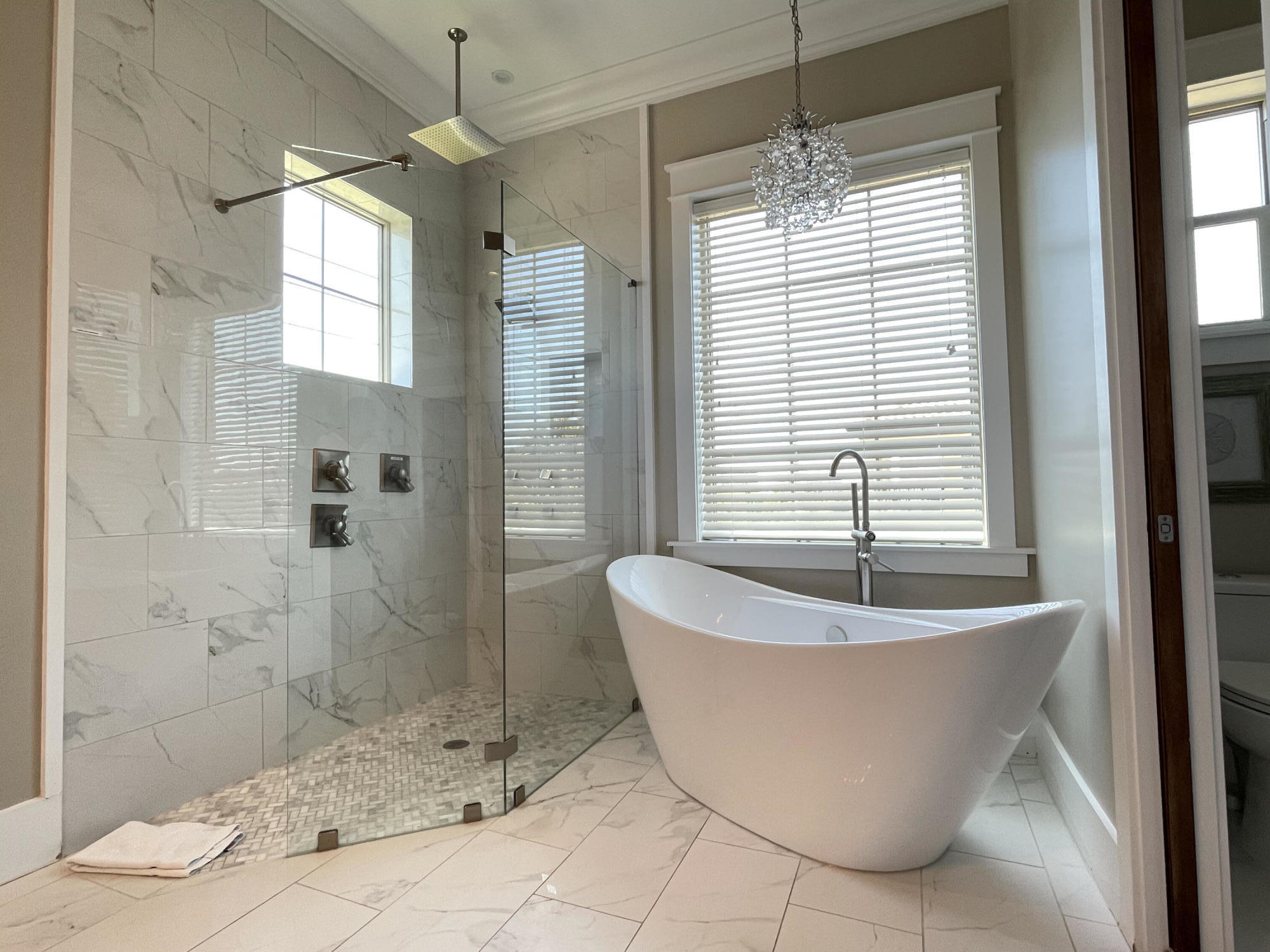 231 Rue St Tropez Miramar Beach, FL 32550 - Photo 20 of 26 a white bath tub sitting in a bathroom next to a window