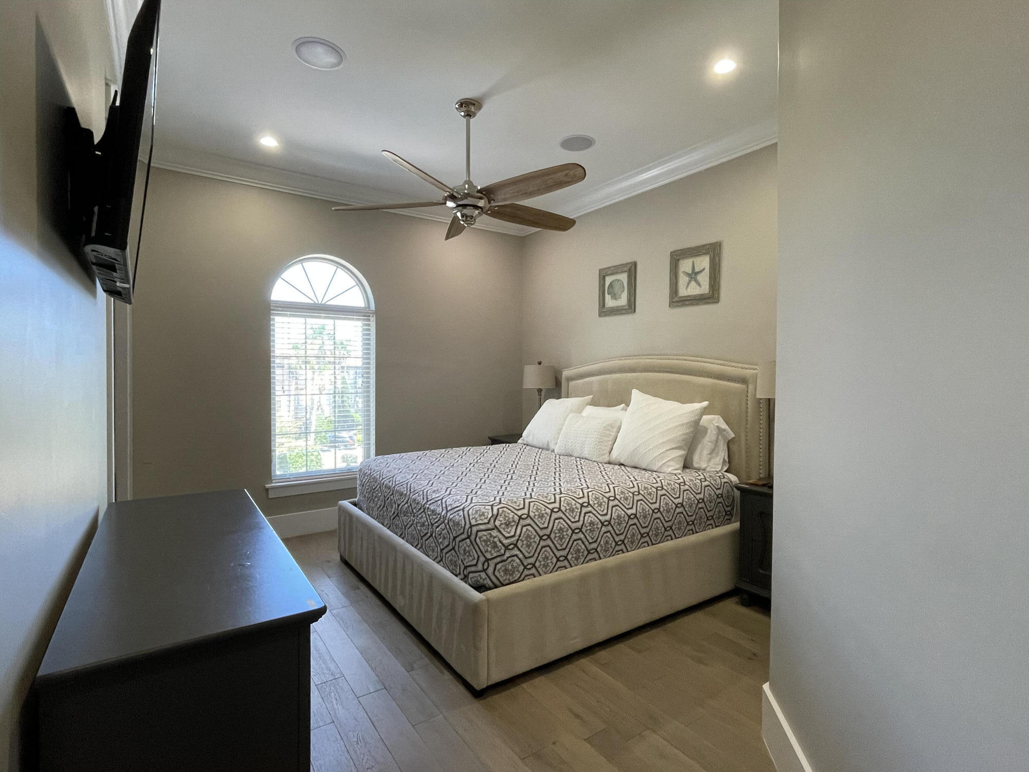 231 Rue St Tropez Miramar Beach, FL 32550 - Photo 22 of 26 a room with a bed and a flat screen tv