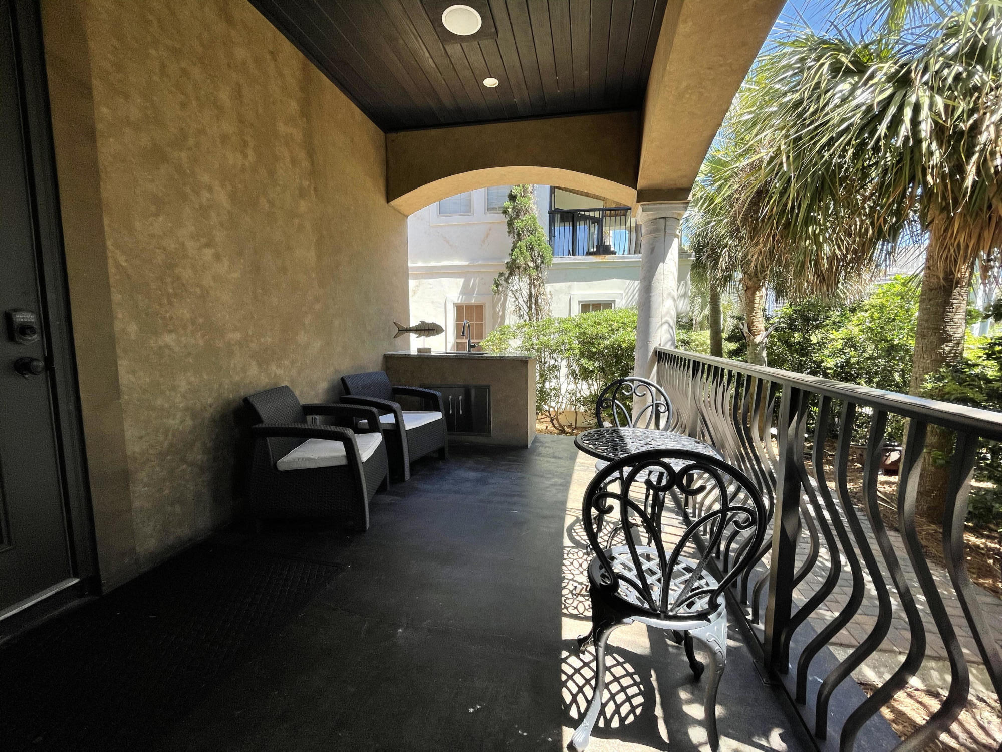 231 Rue St Tropez Miramar Beach, FL 32550 - Photo 6 of 26 a view of a chairs and table in a balcony
