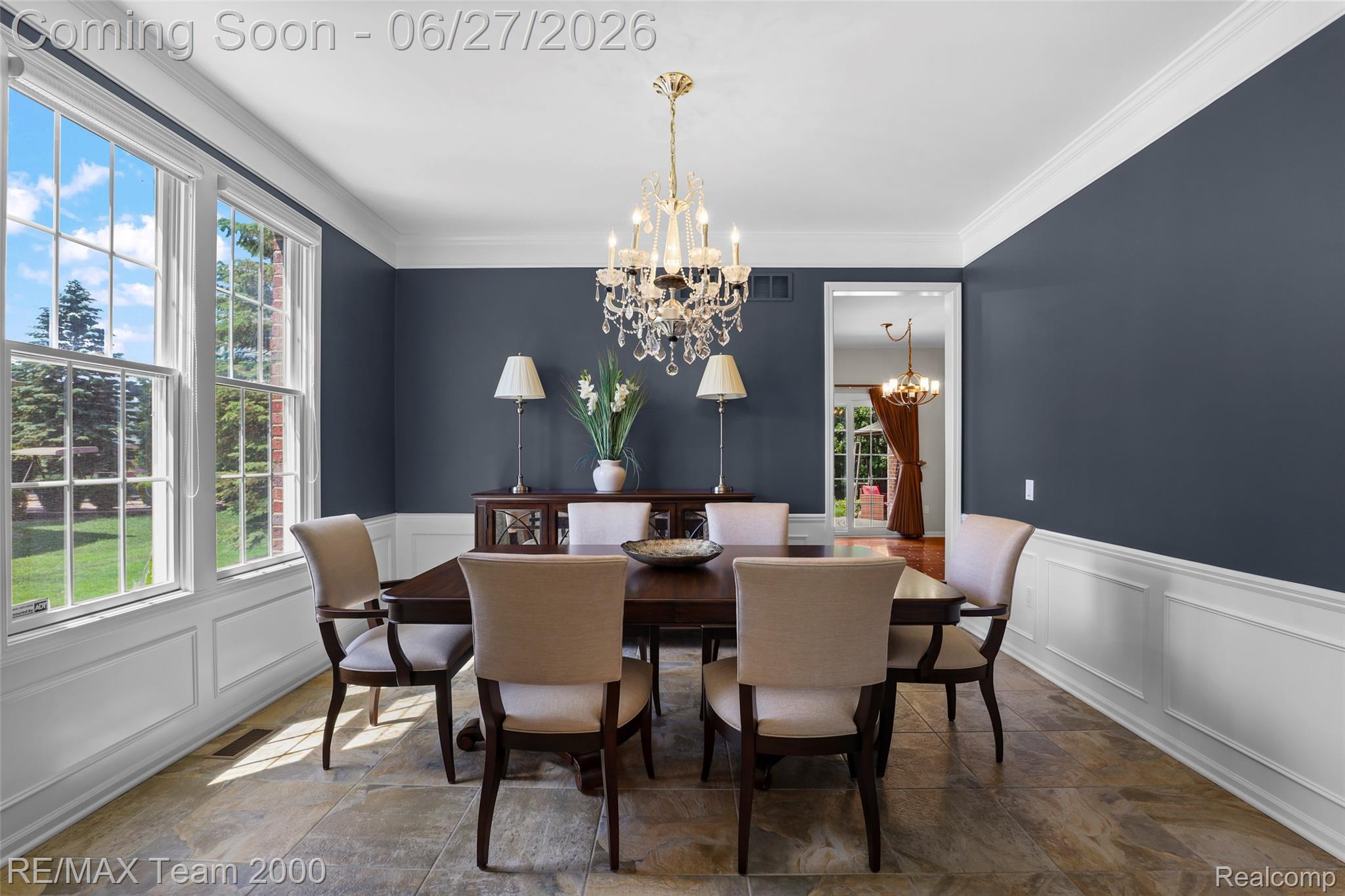 1248 Lasalle Road Canton, MI 48187 - Photo 23 of 67 Dining area featuring tile flooring, wainscoting, and a crystal chandelier