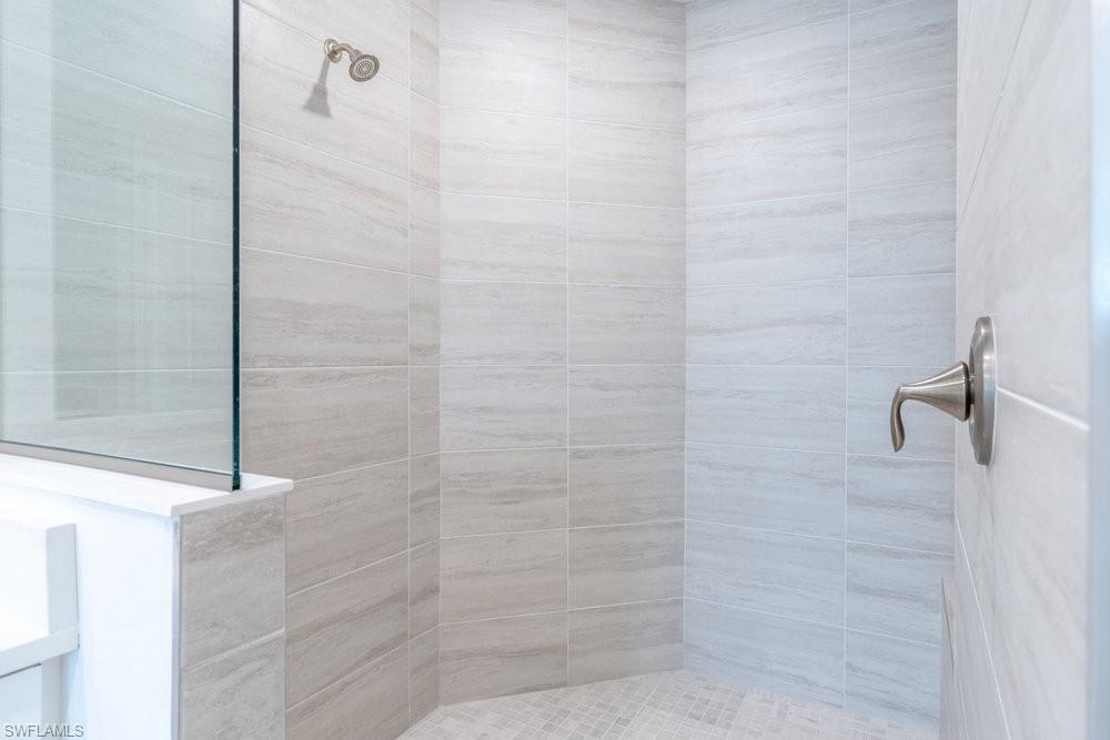 16364 Viansa Way, Unit 202 Naples, FL 34110 - Photo 15 of 39 a bathroom with a shower