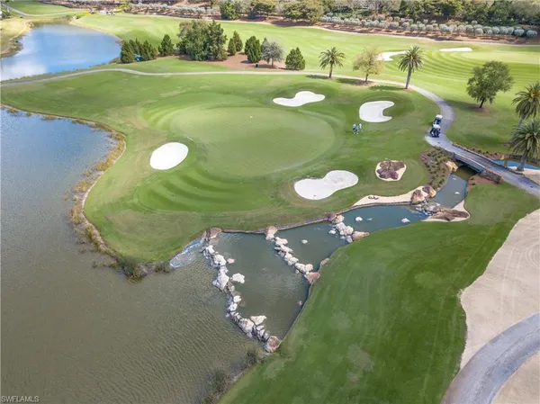 a view of a golf course with a swimming pool