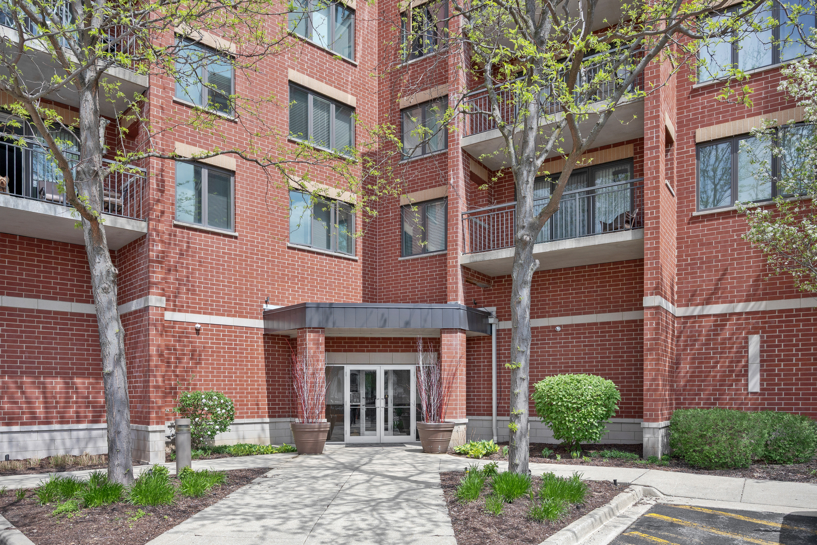 225 Main Street, Unit 216 Roselle, IL 60172 - Photo 16 of 20 a front view of a brick building