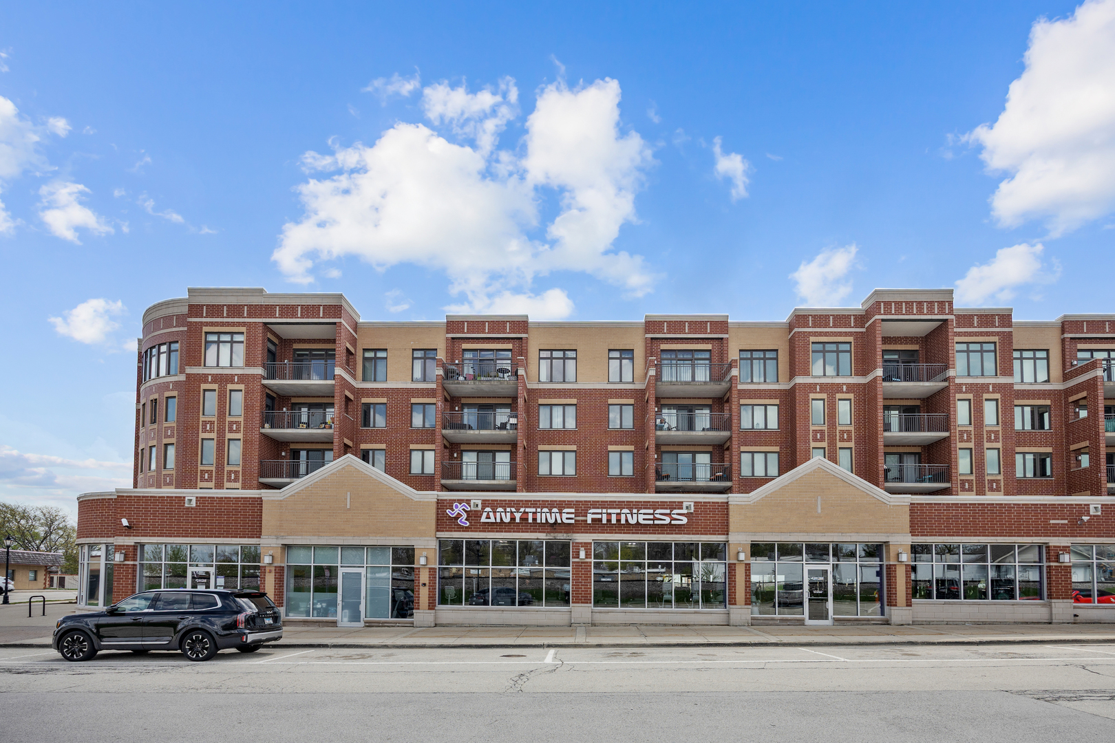 225 Main Street, Unit 216 Roselle, IL 60172 - Photo 2 of 20 a front view of a building with many windows
