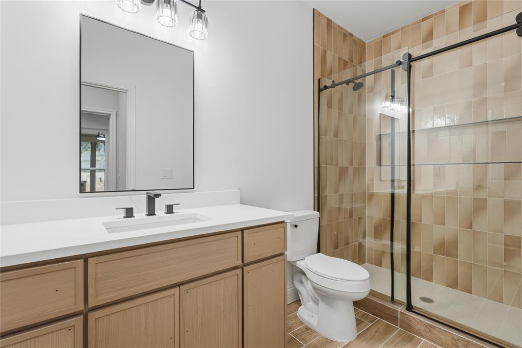 2150 Lakeview Mabank, TX 75156 - Photo 26 of 36 a bathroom with a sink toilet and shower