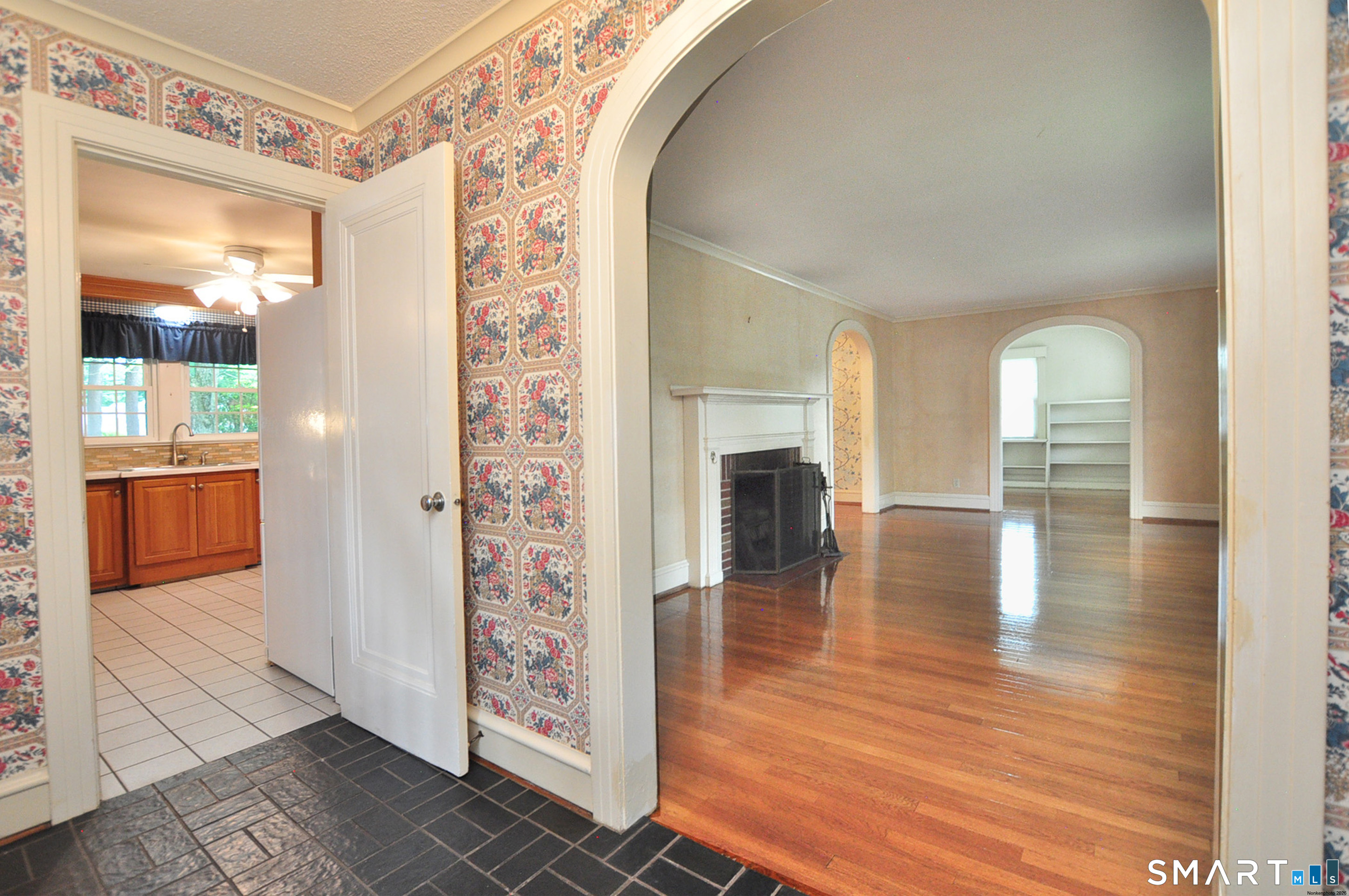 10 Harvey Road Windsor, CT 06095 - Photo 3 of 36 a view of empty room with wooden floor and fireplace