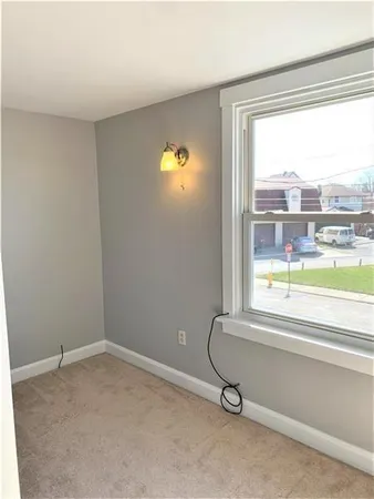 a room with a window and pool view