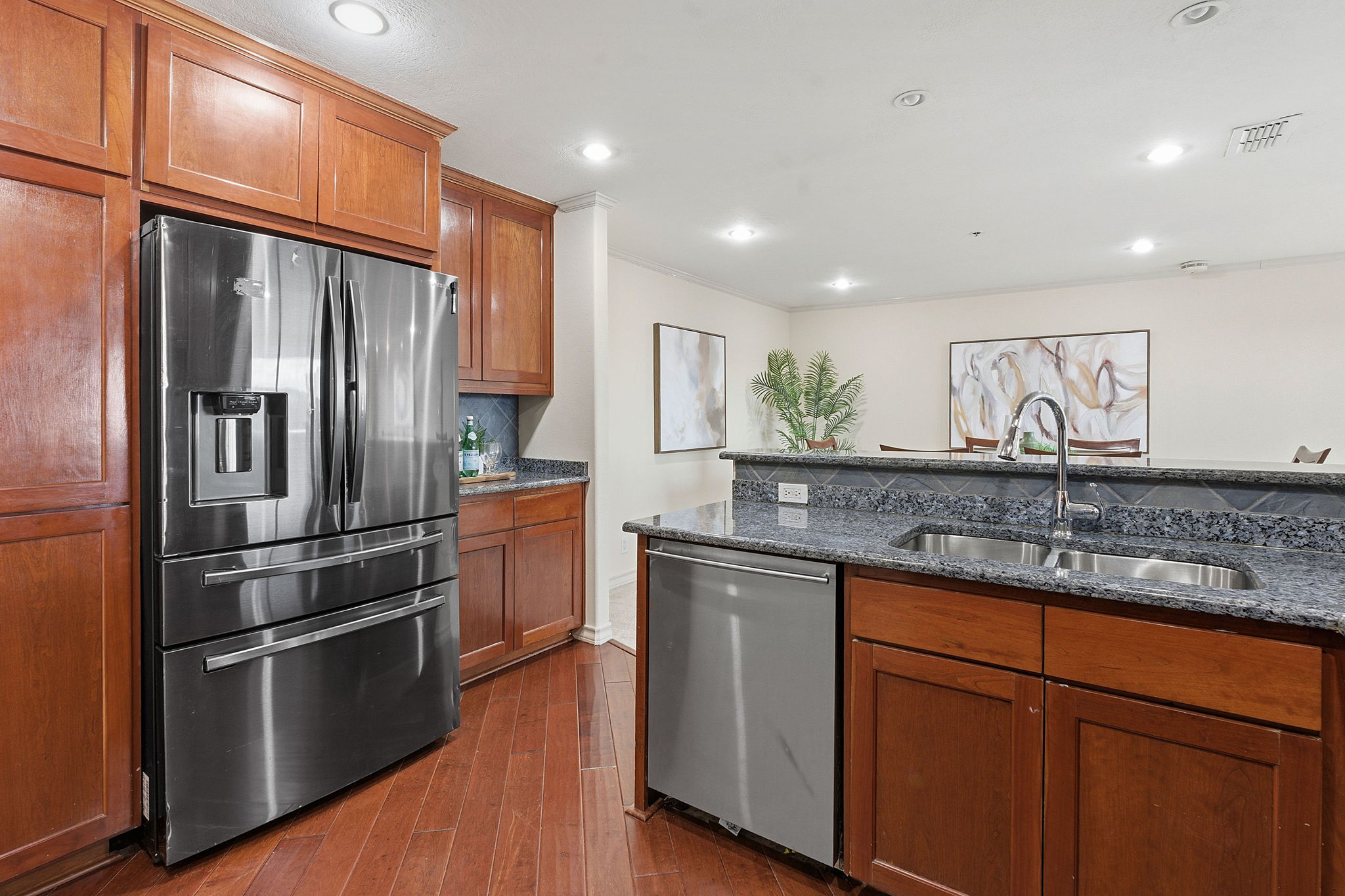 40 North Interstate Highway 35, Unit 10B4 Austin, TX 78701 - Photo 11 of 39 a kitchen with stainless steel appliances granite countertop a refrigerator a sink and a stove