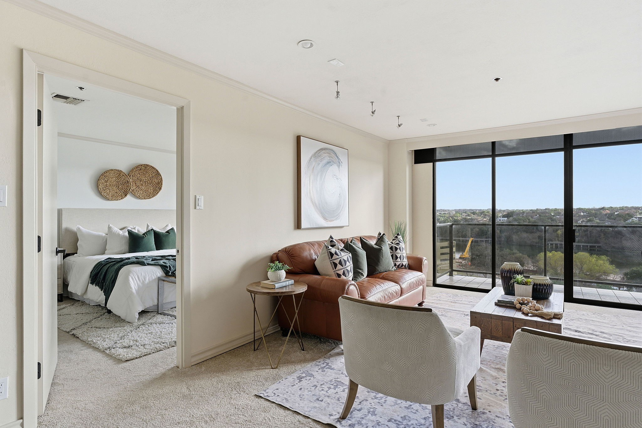40 North Interstate Highway 35, Unit 10B4 Austin, TX 78701 - Photo 12 of 39 a living room with furniture and a floor to ceiling window