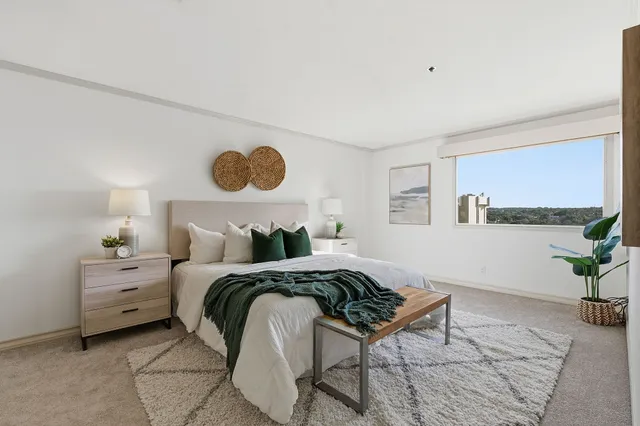 a bedroom with a bed and window