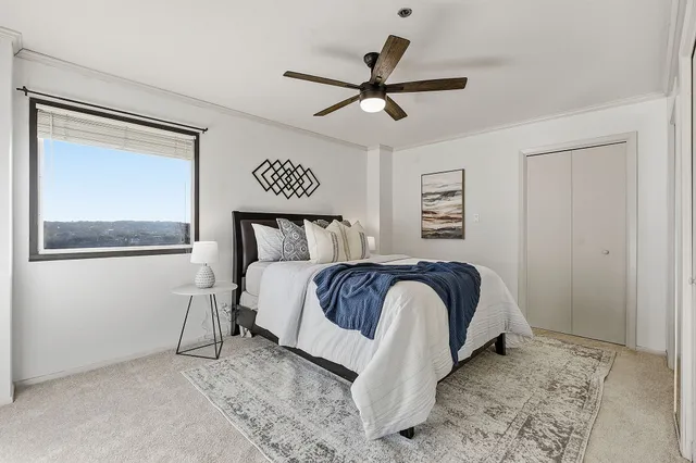 a bedroom with a bed and a window