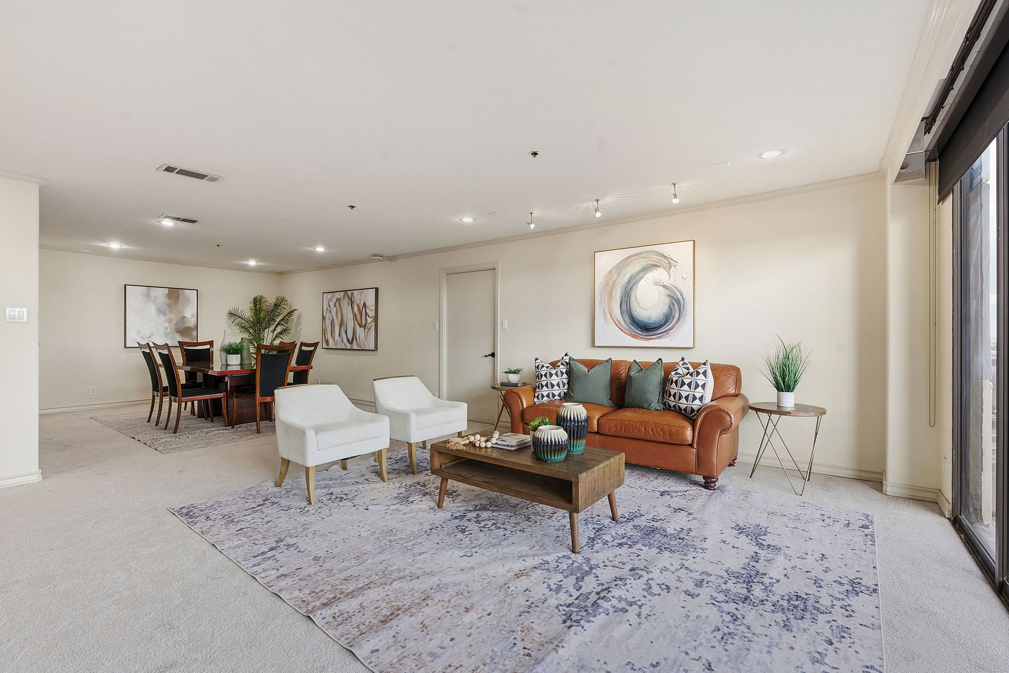 40 North Interstate Highway 35, Unit 10B4 Austin, TX 78701 - Photo 3 of 39 a living room with furniture and a rug