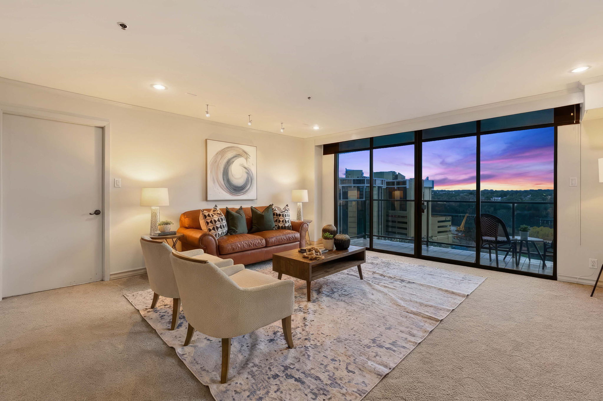 40 North Interstate Highway 35, Unit 10B4 Austin, TX 78701 - Photo 37 of 39 a living room with furniture tv and a large window