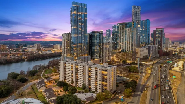 a city skyline with tall buildings