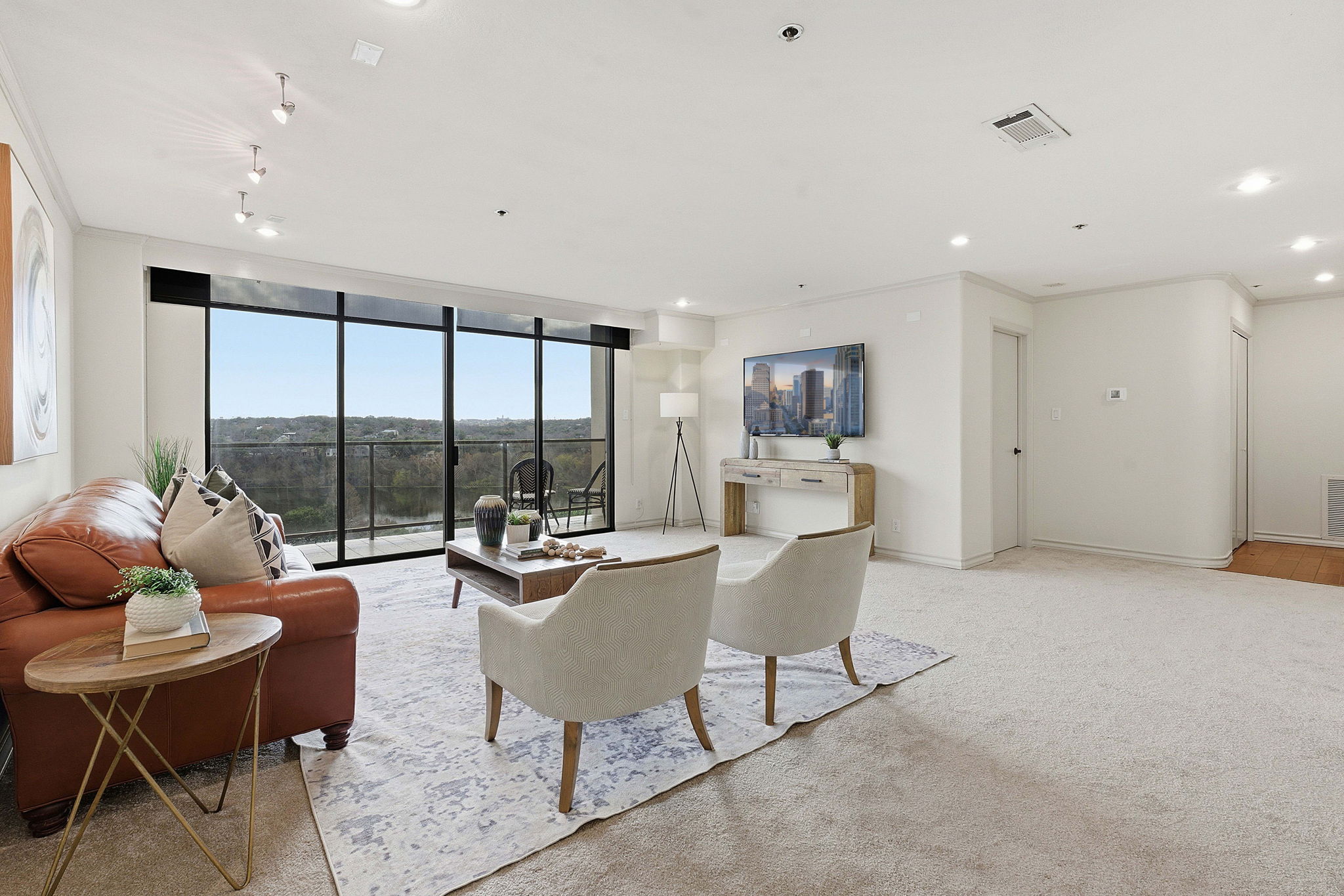 40 North Interstate Highway 35, Unit 10B4 Austin, TX 78701 - Photo 5 of 39 a living room with furniture and a large window