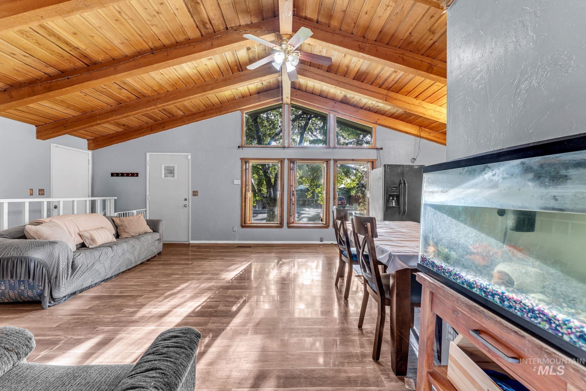 820 Meadows Drive Twin Falls, ID 83301 - Photo 4 of 38 Vaulted wood-finish ceilings with exposed beams and a ceiling fan