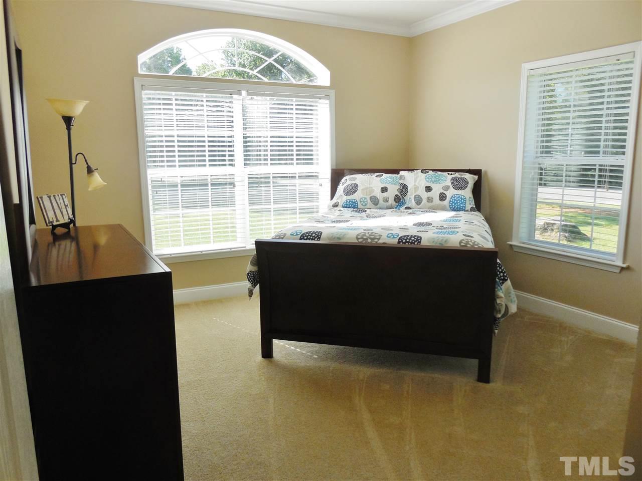 924 Whitt Town Road Roxboro, NC 27574 - Photo 12 of 17 a bed sitting in a bedroom next to a window