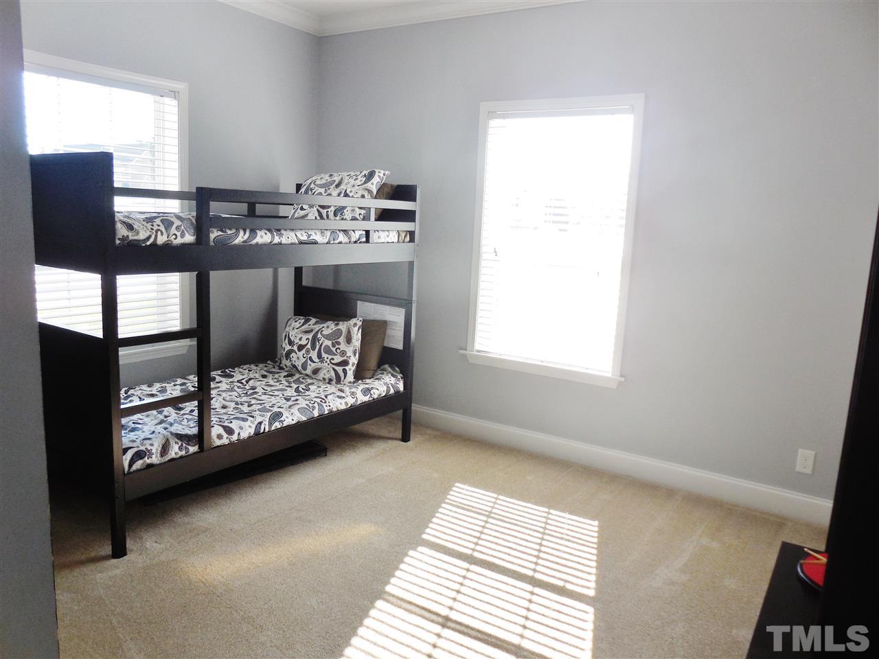 924 Whitt Town Road Roxboro, NC 27574 - Photo 13 of 17 a bedroom with a bed mirror and a window