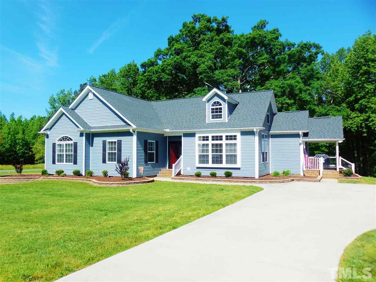 924 Whitt Town Road Roxboro, NC 27574 - Photo 17 of 17 a front view of a house with a yard and trees