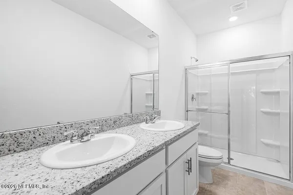 an empty room with a bathroom