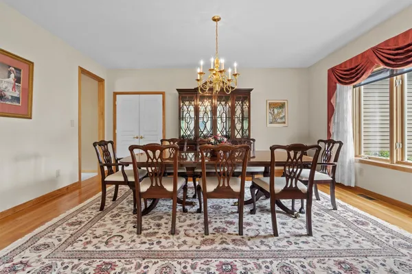 a view of a dining room with furniture and wooden floor