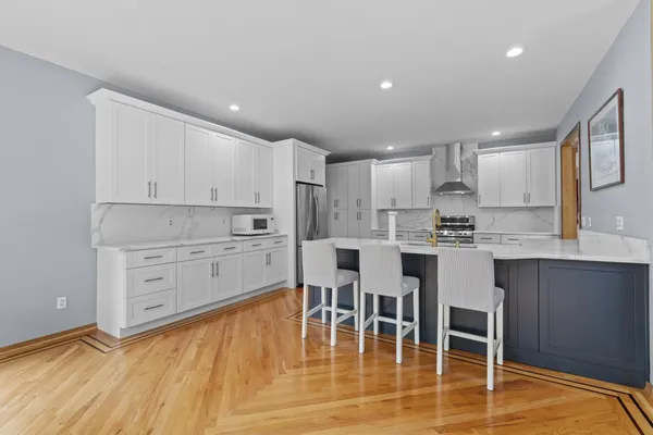 a view of kitchen with dining table and chairs