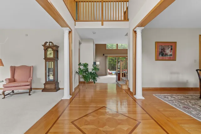 a living room with furniture and a rug