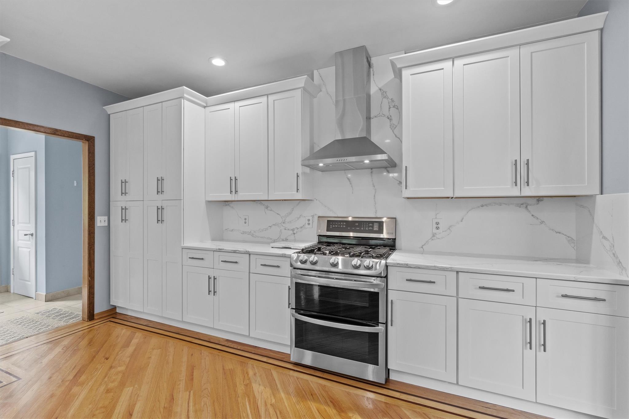 115 Moffat Road Washingtonville, NY 10992 - Photo 23 of 50 a kitchen with granite countertop white cabinets and stainless steel appliances
