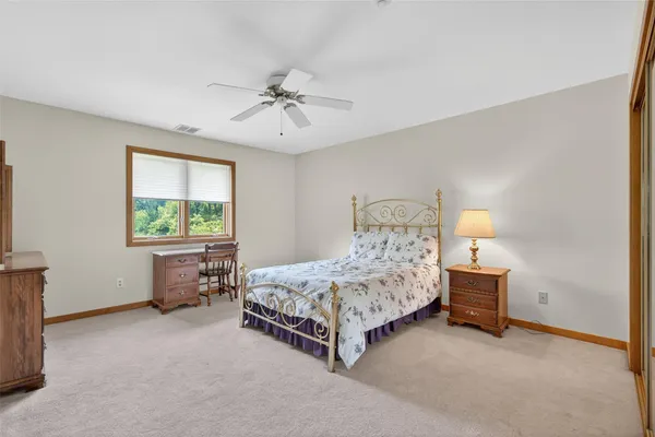 a bathroom with a tub and a toilet