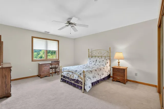 a bathroom with a tub and a toilet