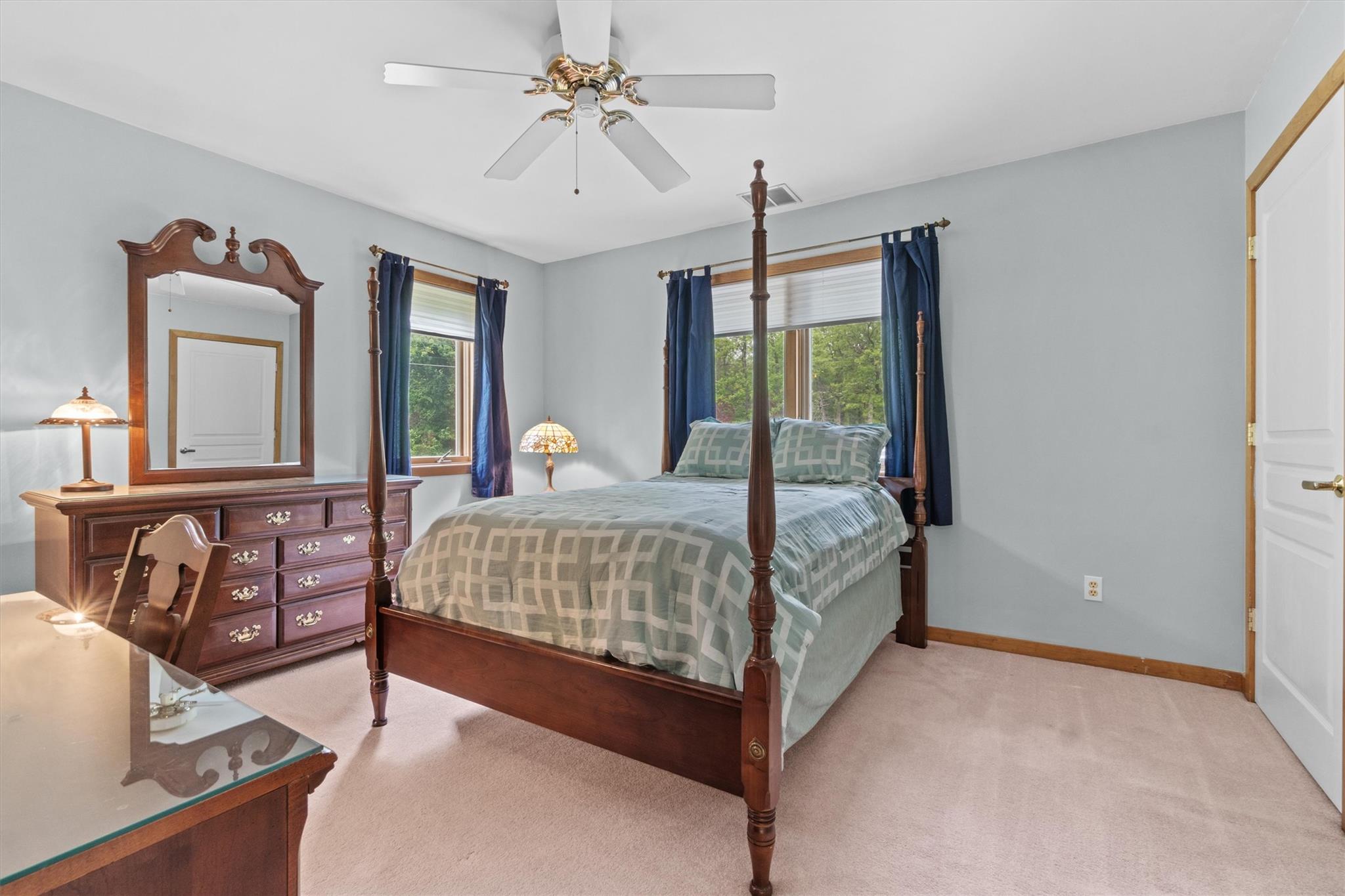 115 Moffat Road Washingtonville, NY 10992 - Photo 34 of 50 a bedroom with a bed a chandelier and dresser