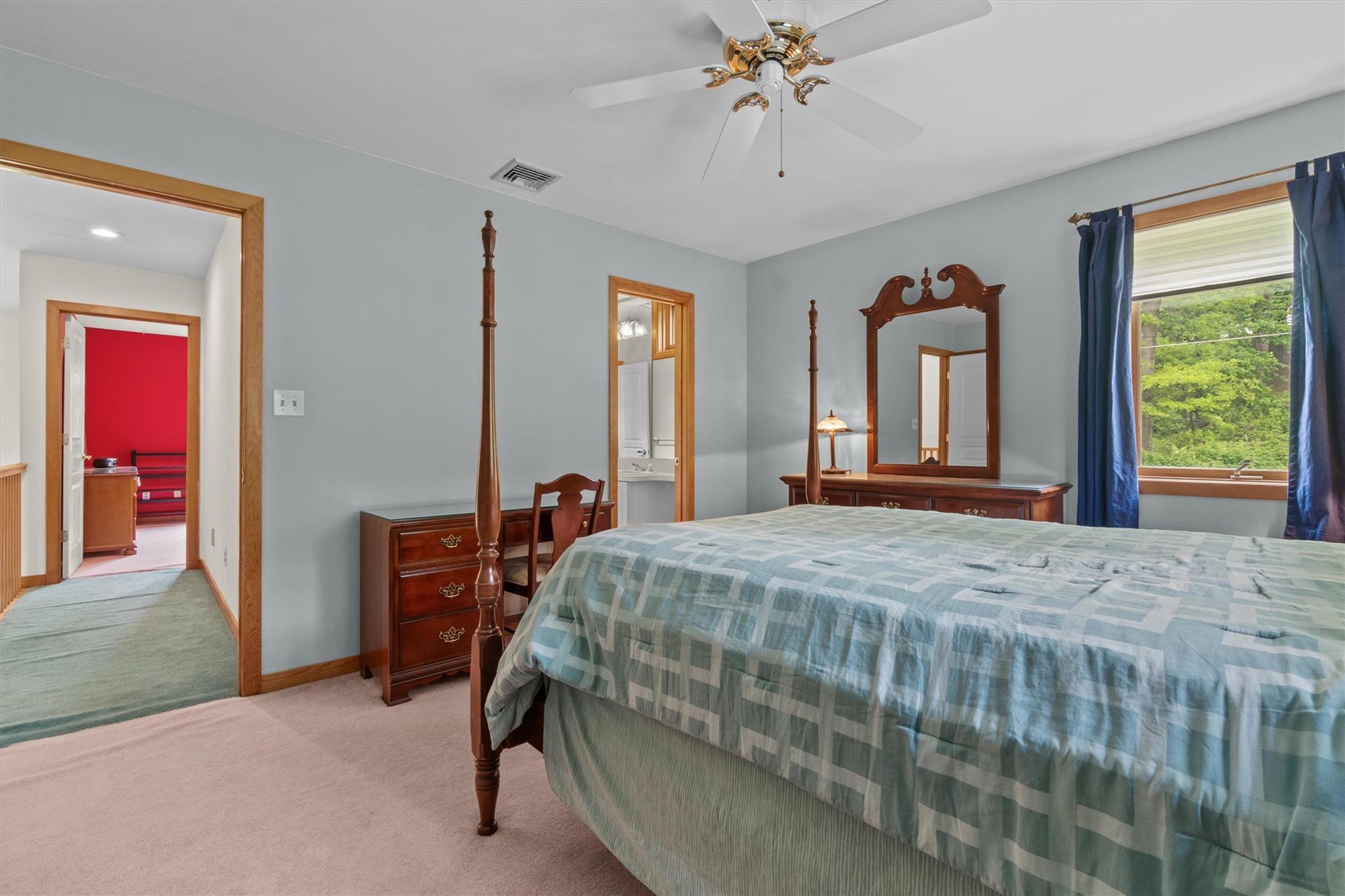 115 Moffat Road Washingtonville, NY 10992 - Photo 36 of 50 a bedroom with a bed and a chandelier