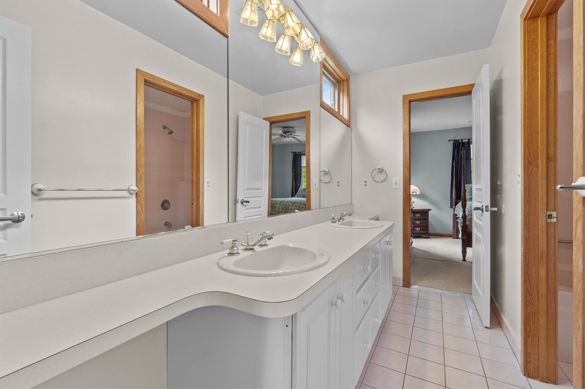 115 Moffat Road Washingtonville, NY 10992 - Photo 38 of 50 a en suite bathroom with a sink a mirror and a bathtub