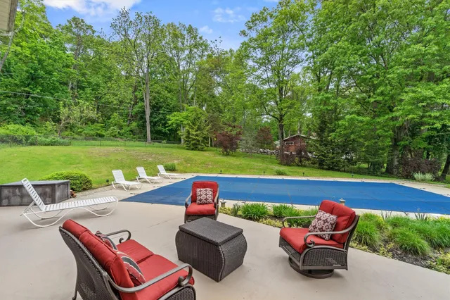 a house with a big yard and large trees