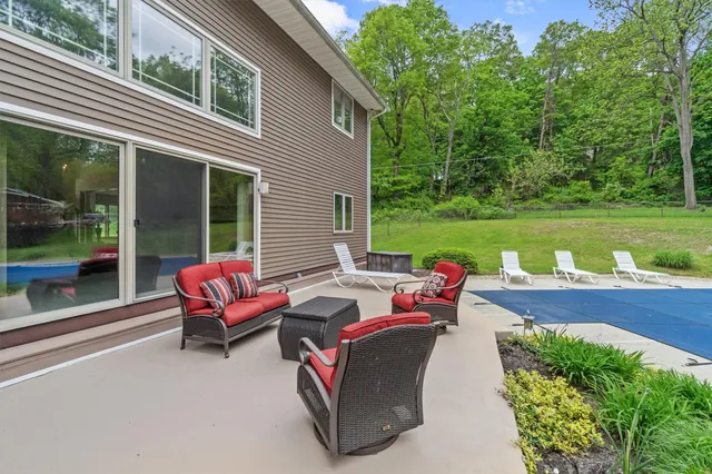 a view of a chairs and table in the patio