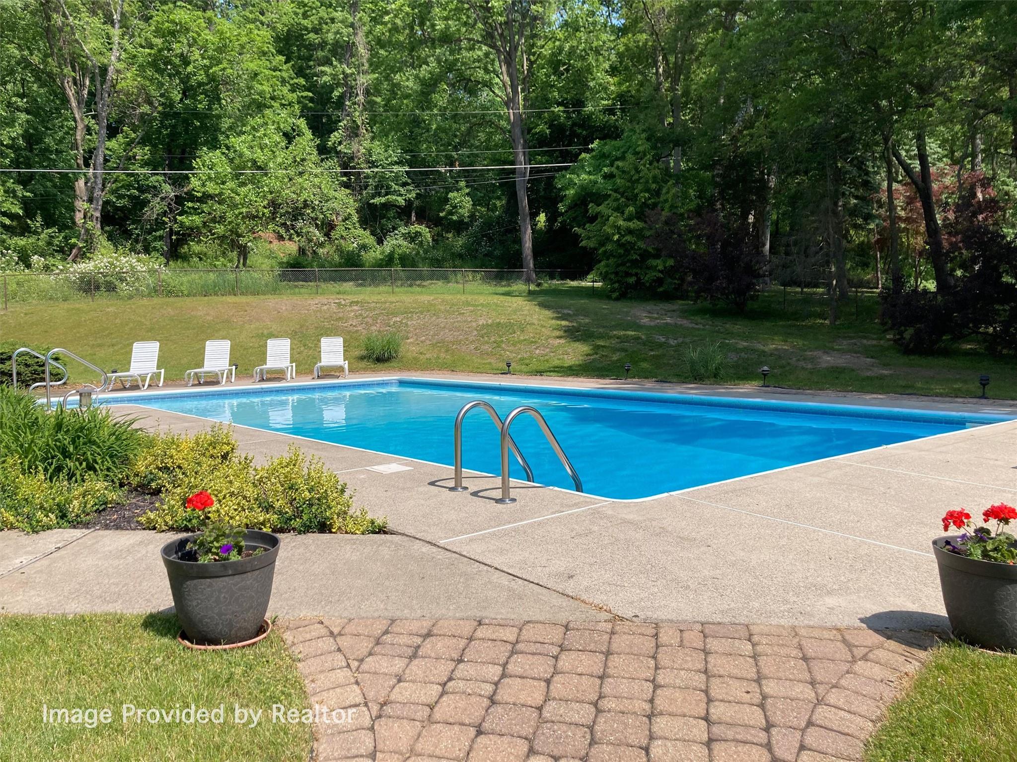 115 Moffat Road Washingtonville, NY 10992 - Photo 41 of 50 a view of a backyard with plants and lake