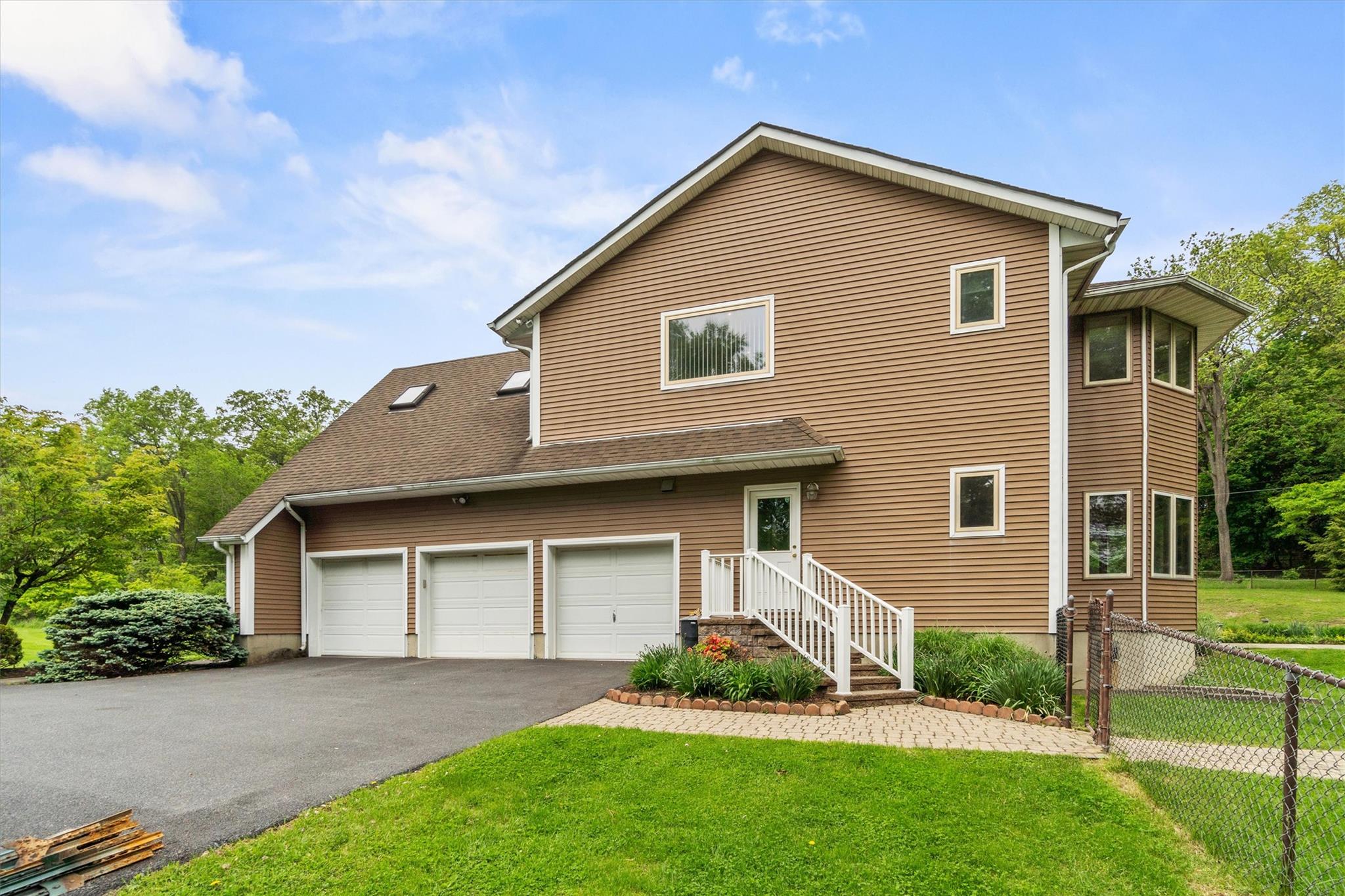 115 Moffat Road Washingtonville, NY 10992 - Photo 42 of 50 a front view of a house with a garden and plants