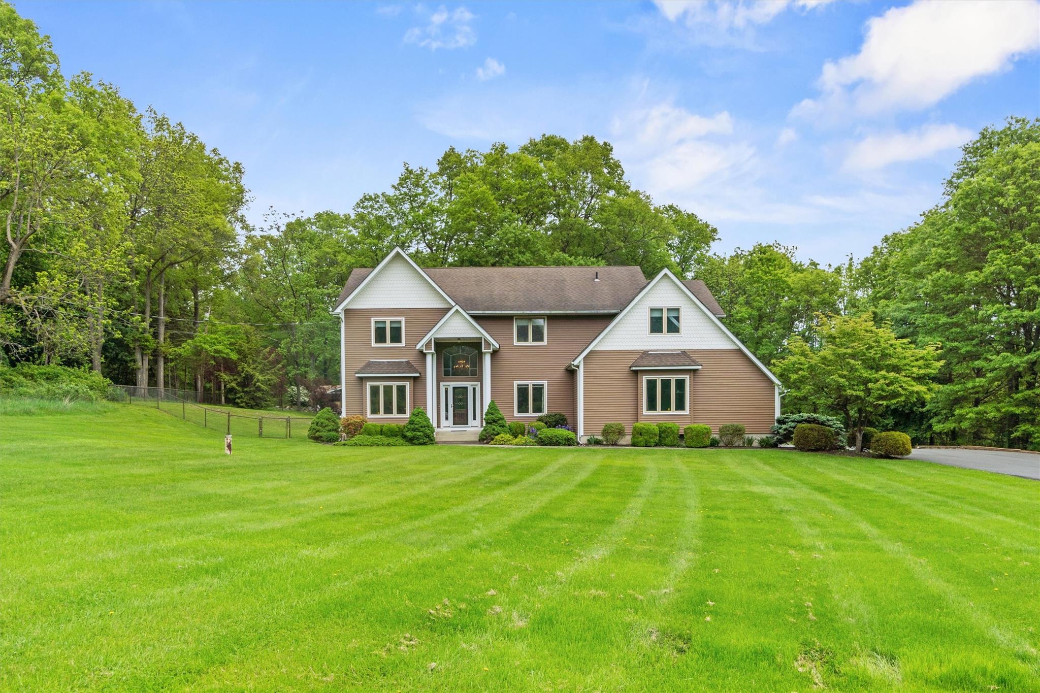 115 Moffat Road Washingtonville, NY 10992 - Photo 43 of 50 a house with a big yard and large trees