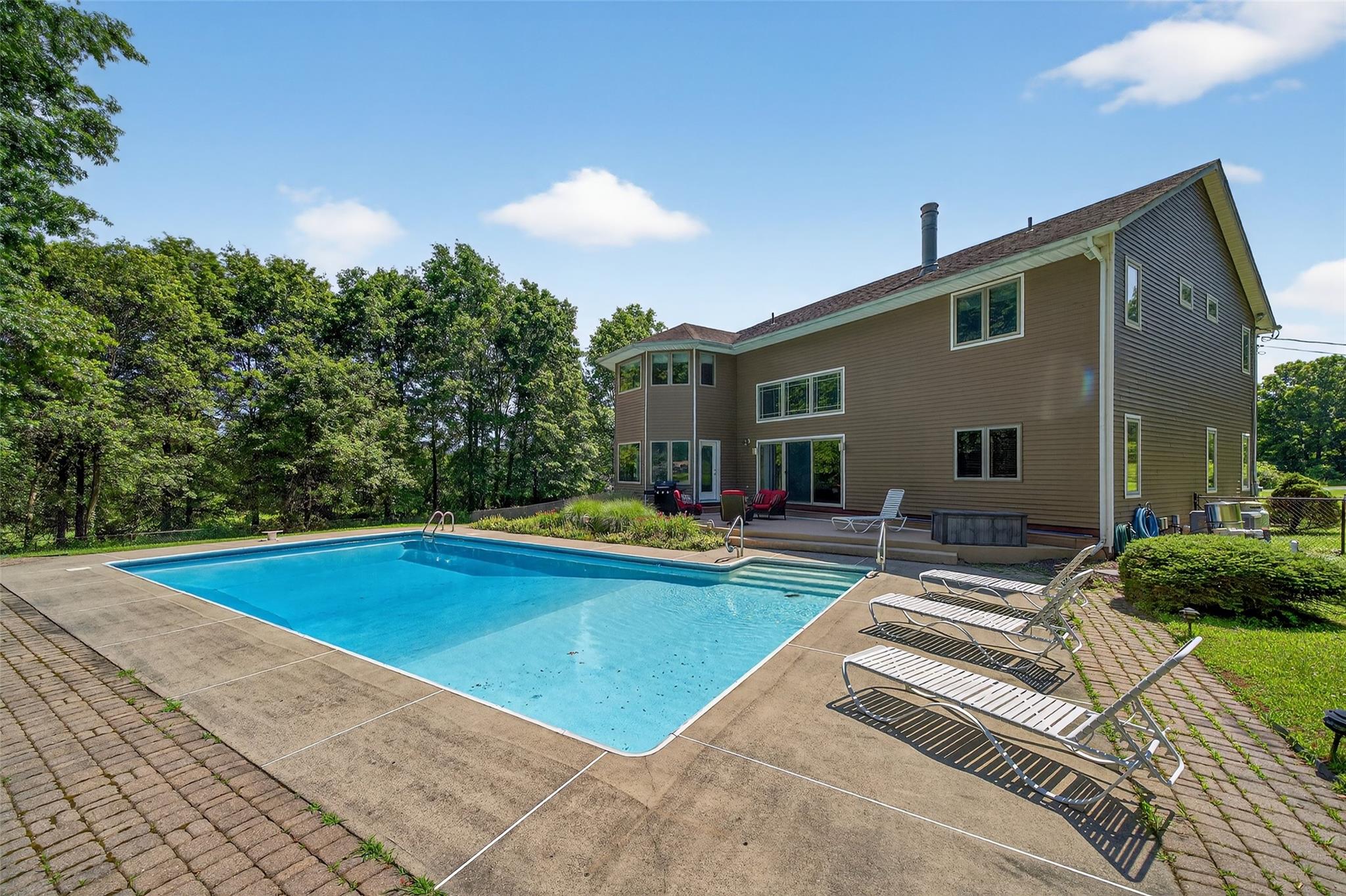 115 Moffat Road Washingtonville, NY 10992 - Photo 47 of 50 a view of pool with lawn chairs and plants