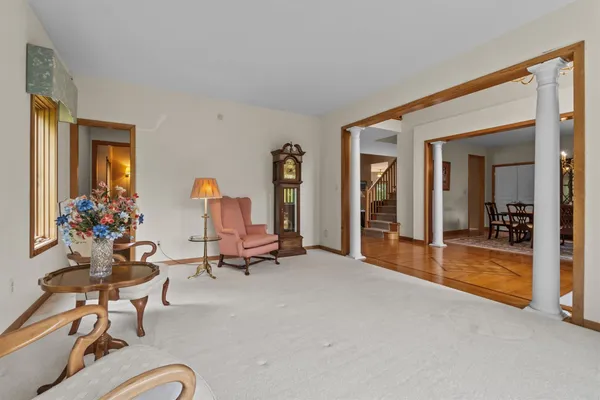 a view of a livingroom with furniture and a porch