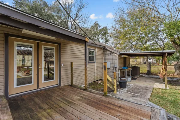a view of a house with backyard porch and sitting area
