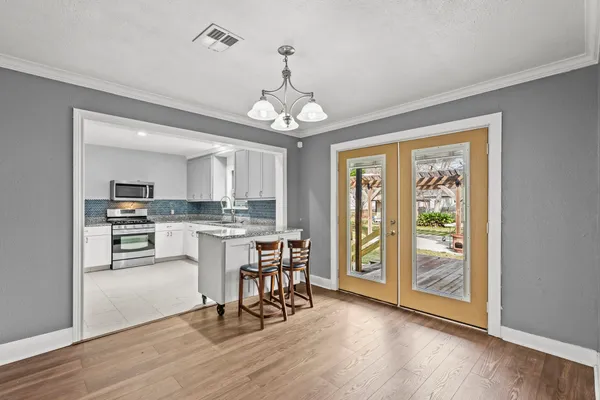 a view of a dining room with furniture window and wooden floor