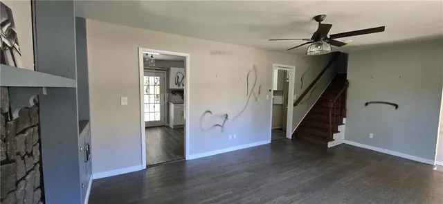 a view of an entryway with wooden floor and stairs