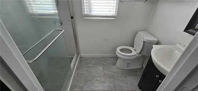 a bathroom with a toilet and a sink