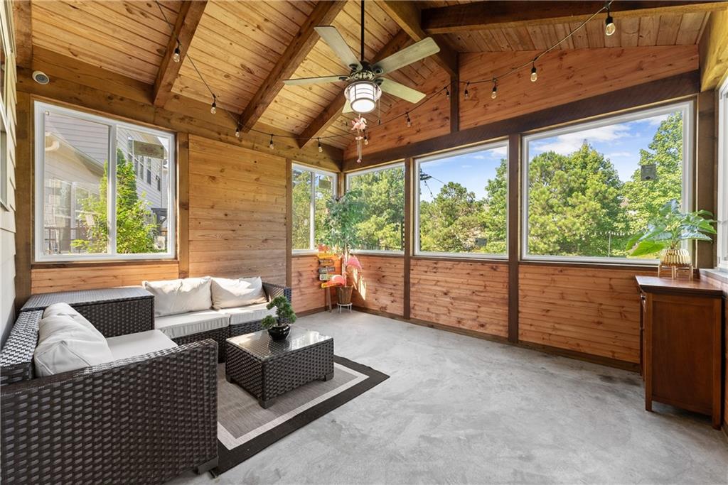 2228 Lakeview Bend Way Buford, GA 30519 - Photo 11 of 36 a living room with furniture and a large window