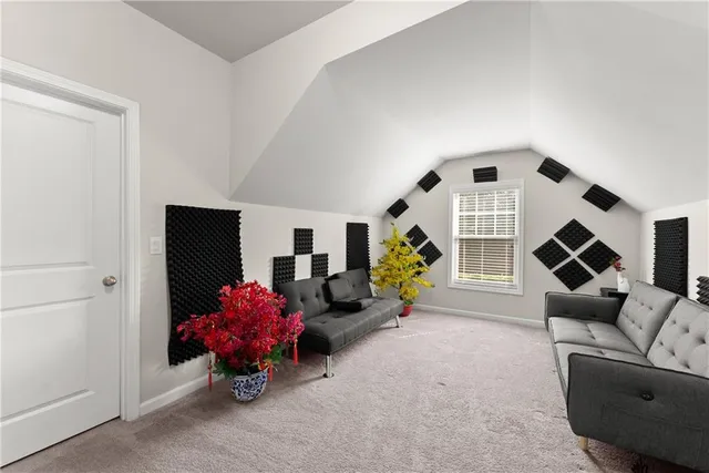 a living room with furniture and flat screen tv